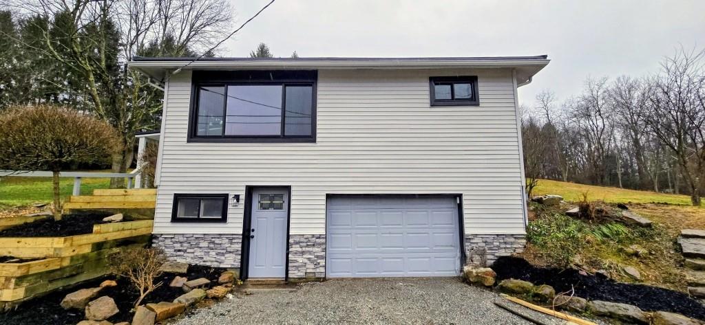 916 Indiana Avenue Avonmore, PA 15618 - Photo 30 of 32 a front view of a house with a yard