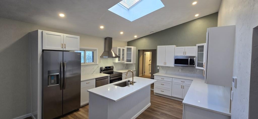 916 Indiana Avenue Avonmore, PA 15618 - Photo 5 of 32 a kitchen with stainless steel appliances a refrigerator sink and microwave