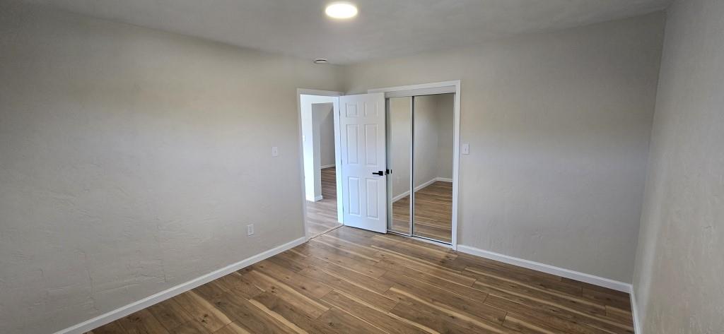 916 Indiana Avenue Avonmore, PA 15618 - Photo 10 of 32 a view of an empty room with wooden floor and a window