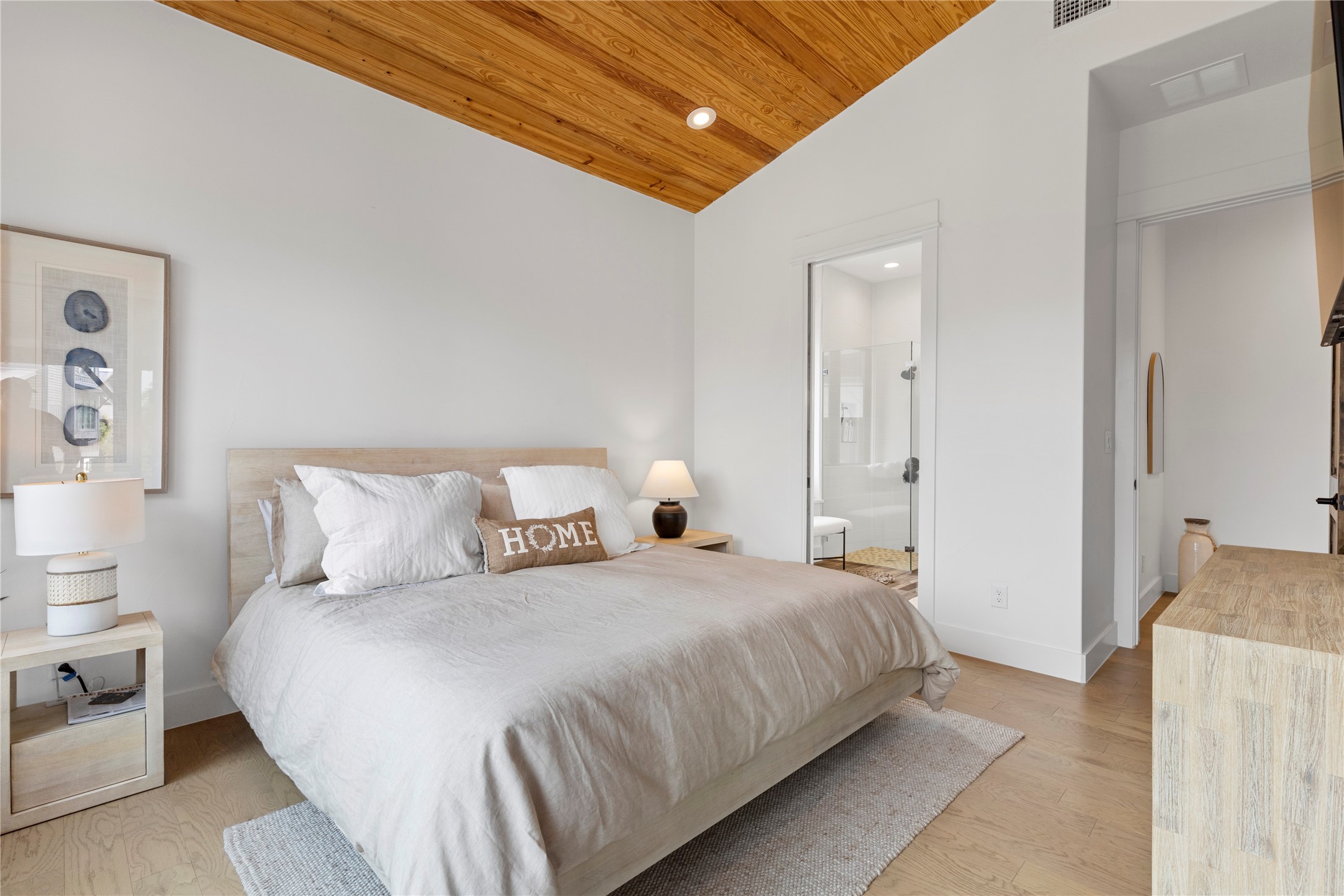 19216 Lost Tree, Unit 8 Spicewood, TX 78669 - Photo 12 of 27 Primary bedroom with ensuite bathroom
