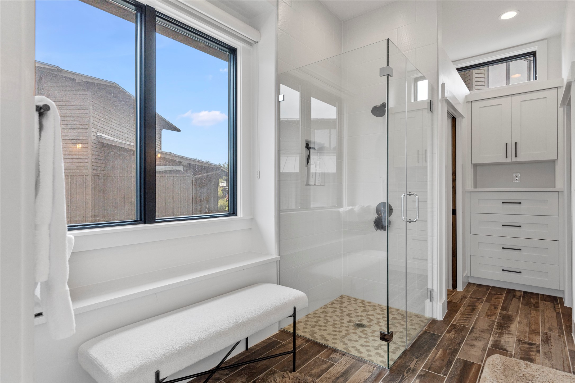 19216 Lost Tree, Unit 8 Spicewood, TX 78669 - Photo 13 of 27 Ensuite bathroom with double vanity sink area, walk in closet and built in storage