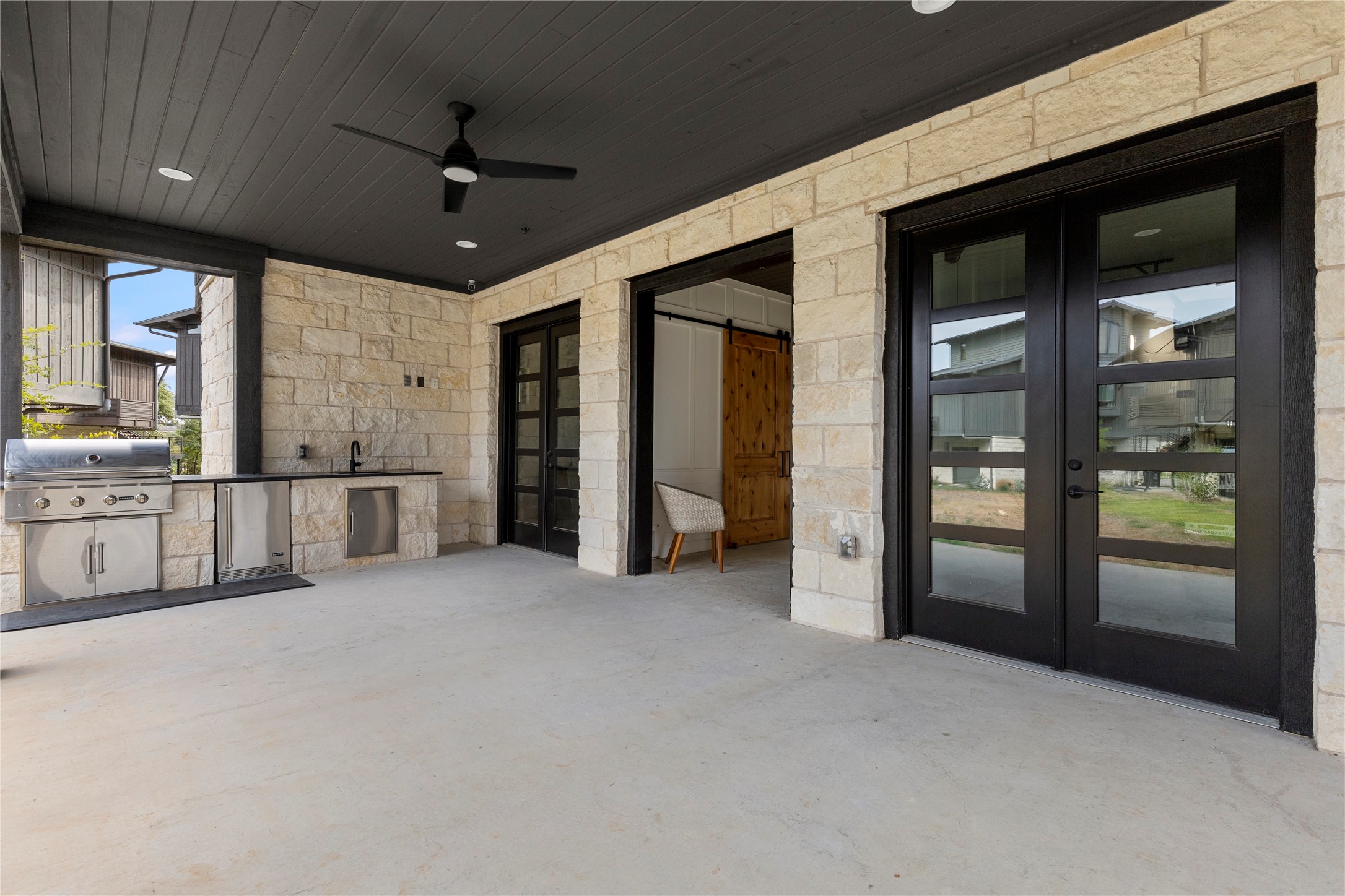 19216 Lost Tree, Unit 8 Spicewood, TX 78669 - Photo 25 of 27 Outdoor kitchen with patio for cooking and chatting with neighbors