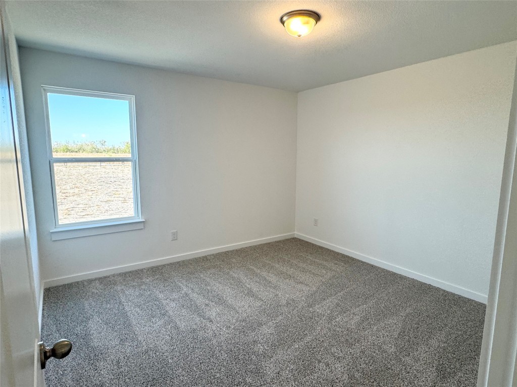 128 Hazy Vw Road San Marcos, TX 78666 - Photo 13 of 22 an empty room with a window