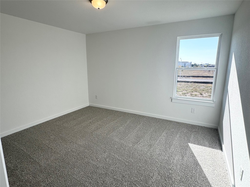 128 Hazy Vw Road San Marcos, TX 78666 - Photo 14 of 22 an empty room with windows