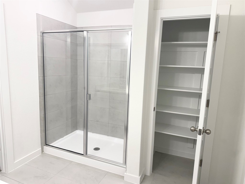 128 Hazy Vw Road San Marcos, TX 78666 - Photo 17 of 22 a bathroom that has a glass shower door