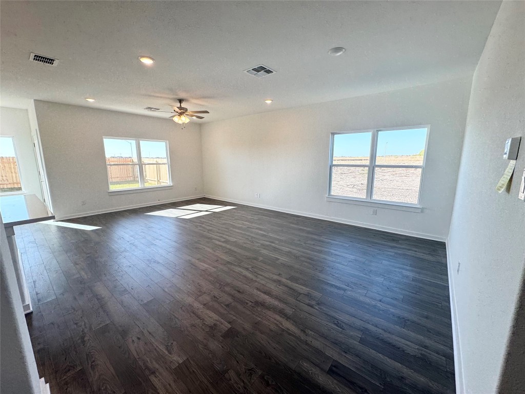 128 Hazy Vw Road San Marcos, TX 78666 - Photo 5 of 22 an empty room with wooden floor and windows