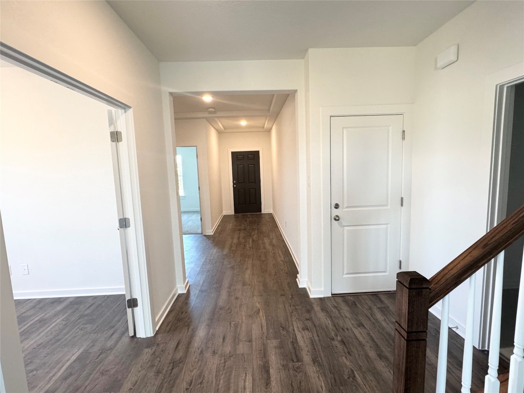128 Hazy Vw Road San Marcos, TX 78666 - Photo 6 of 22 a view of a hallway with wooden floor and staircase
