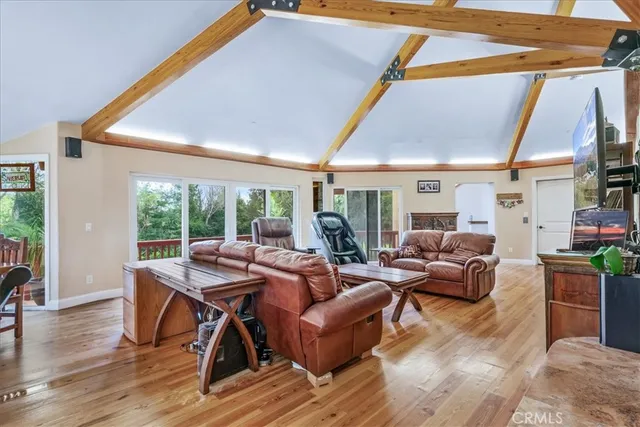 a view of balcony with wooden floor and fence