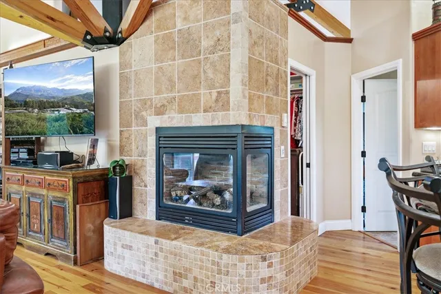 a bathroom with a granite countertop toilet a sink and a mirror