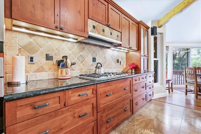 a bed sitting in a spacious bedroom next to a window