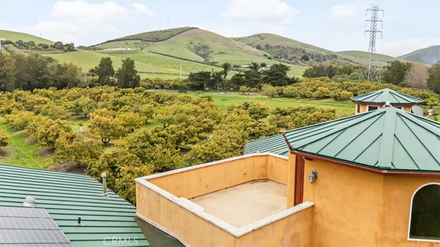 a kitchen with stainless steel appliances granite countertop wooden cabinets a stove a sink and a refrigerator