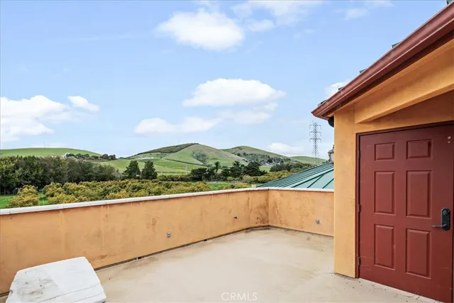 a kitchen with stainless steel appliances granite countertop wooden cabinets a stove and a sink