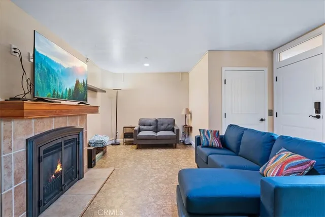 a bathroom with a granite countertop sink a mirror a bathtub and shower
