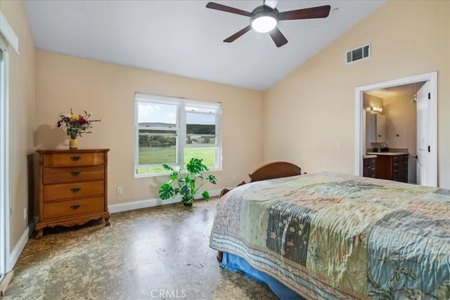 a bedroom with a bed and a desk