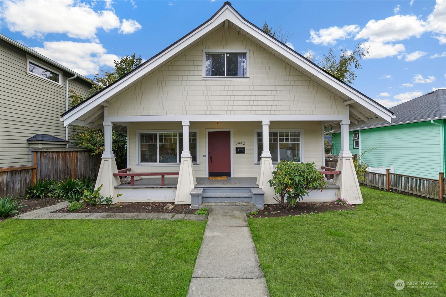5942 41st Avenue Southwest Seattle, WA 98136 - Photo 1 of 40 a front view of a house with garden
