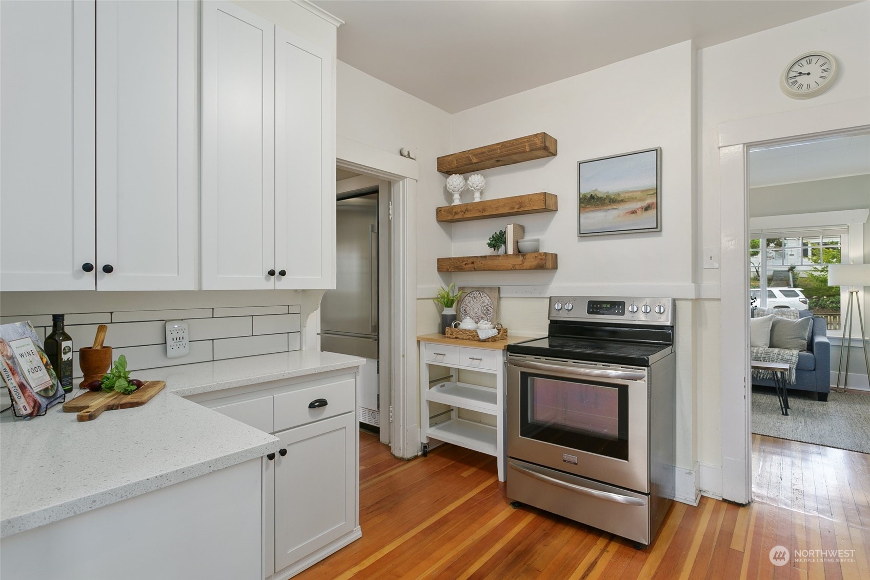 5942 41st Avenue Southwest Seattle, WA 98136 - Photo 11 of 40 a kitchen with stainless steel appliances a stove a sink and a refrigerator