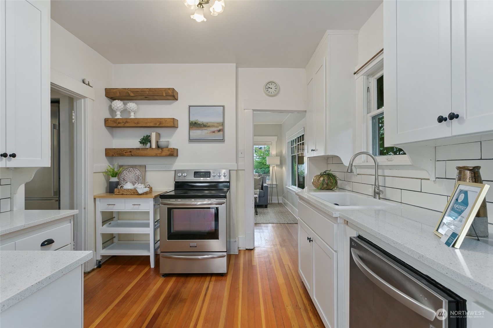 5942 41st Avenue Southwest Seattle, WA 98136 - Photo 13 of 40 a kitchen with a sink appliances and cabinets