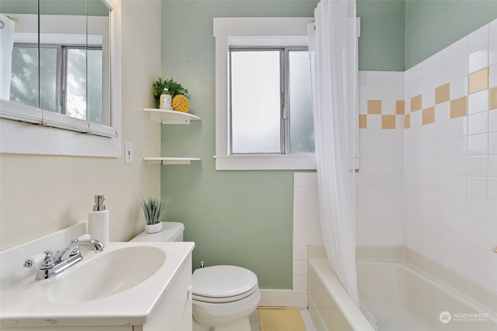 5942 41st Avenue Southwest Seattle, WA 98136 - Photo 24 of 40 a bathroom with a sink toilet and shower
