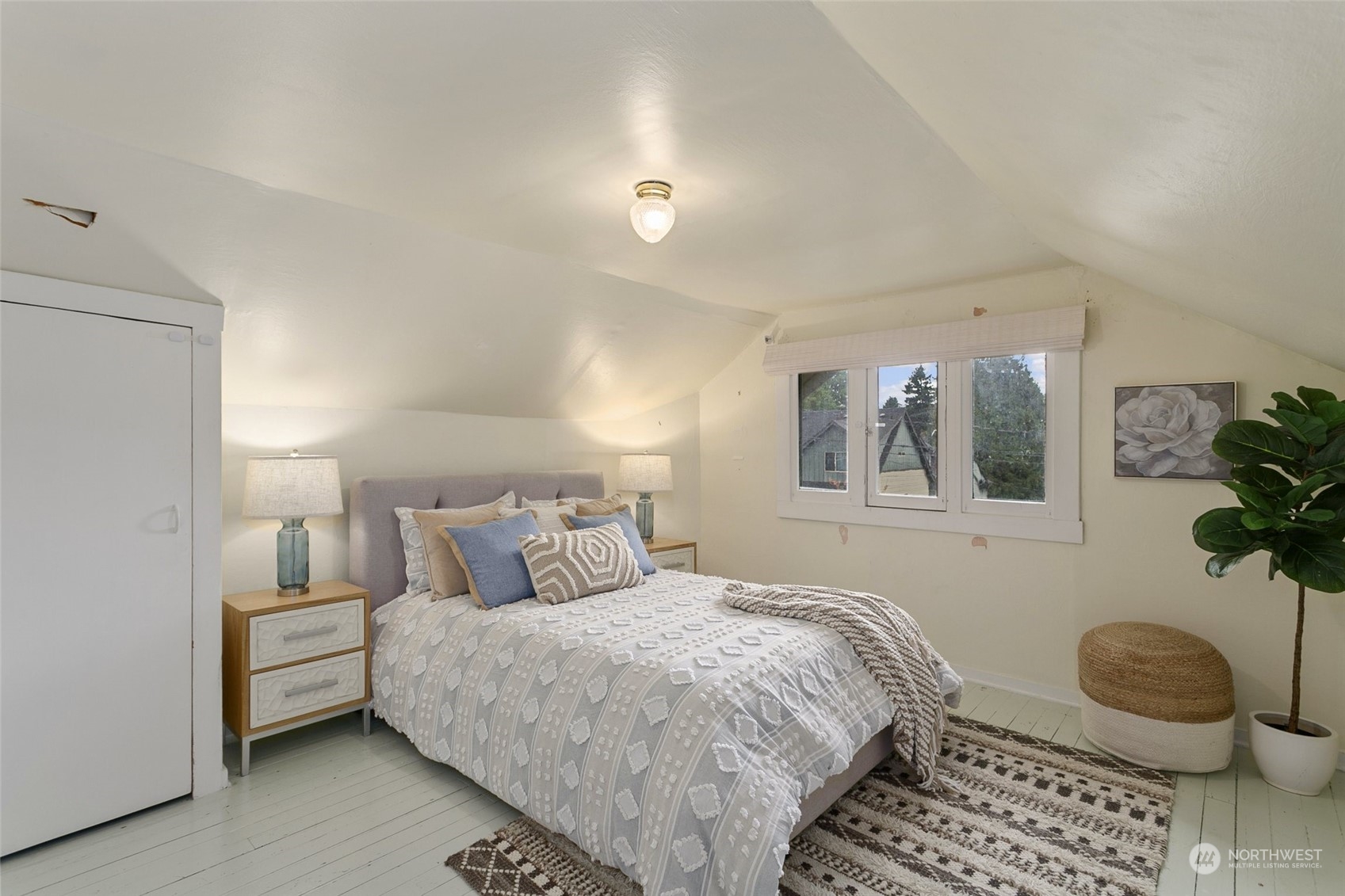 5942 41st Avenue Southwest Seattle, WA 98136 - Photo 25 of 40 a bedroom with a bed and a window