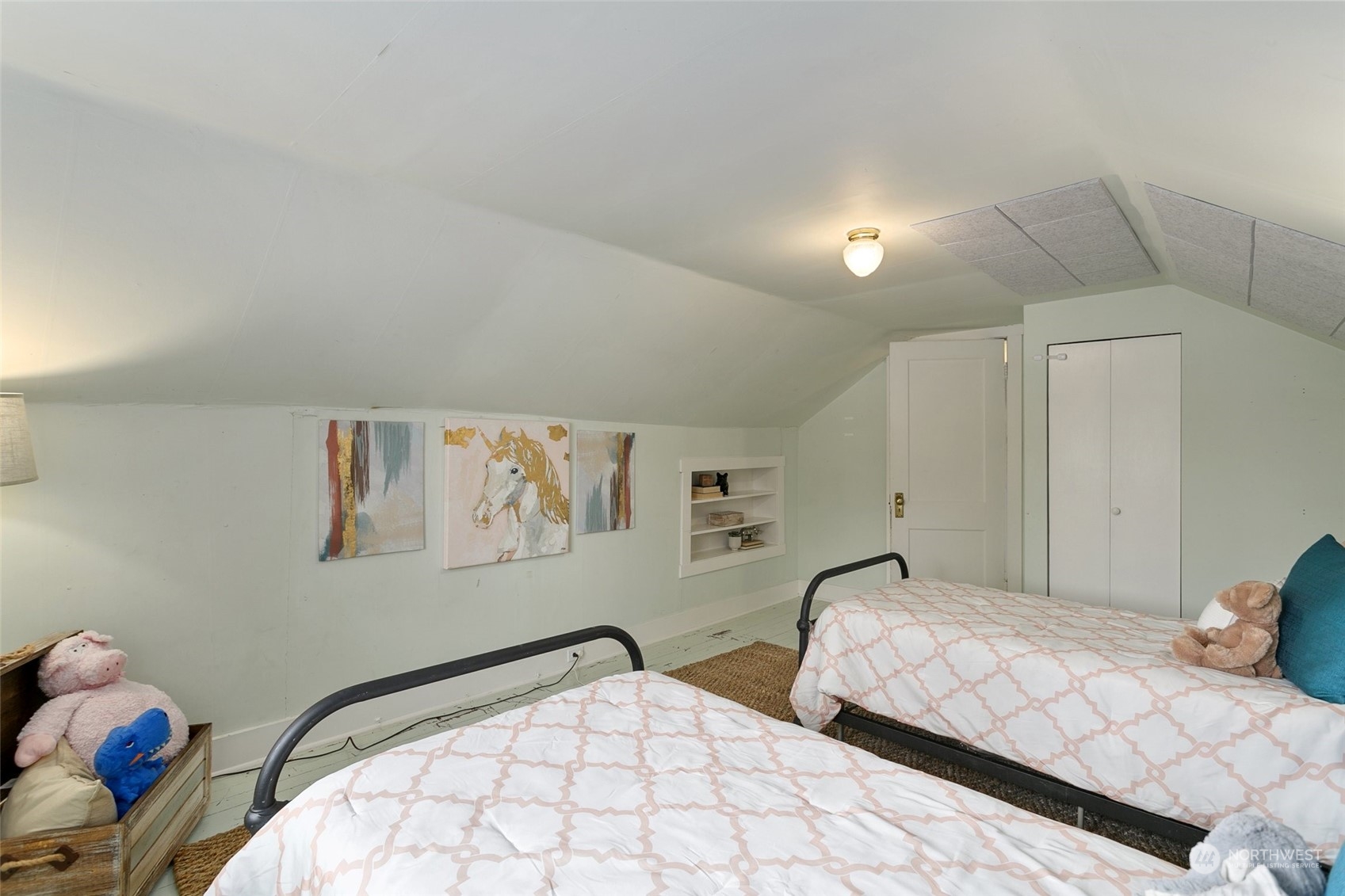5942 41st Avenue Southwest Seattle, WA 98136 - Photo 28 of 40 a bedroom with two beds and a painting on the wall