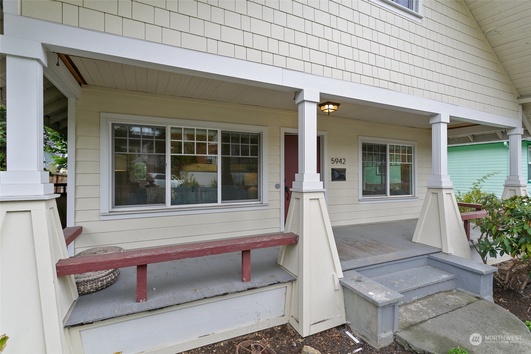 5942 41st Avenue Southwest Seattle, WA 98136 - Photo 3 of 40 front view of house with bench