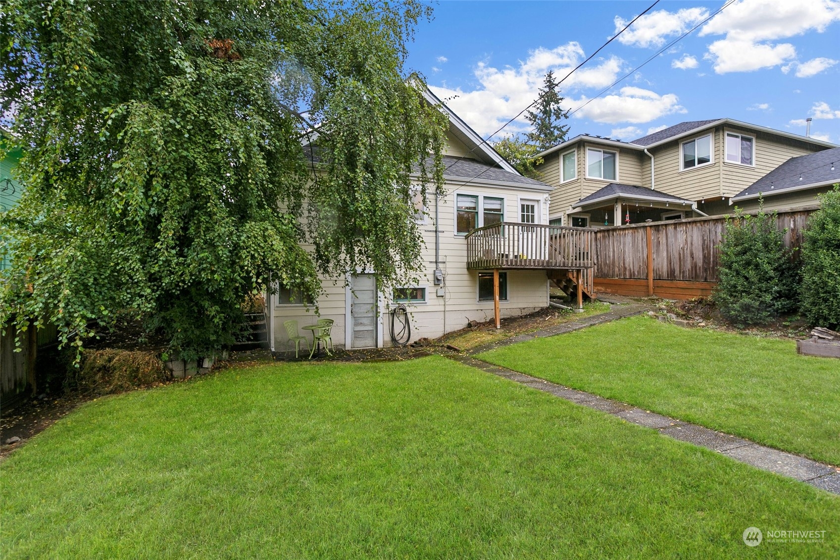 5942 41st Avenue Southwest Seattle, WA 98136 - Photo 35 of 40 a front view of a house with a garden and yard