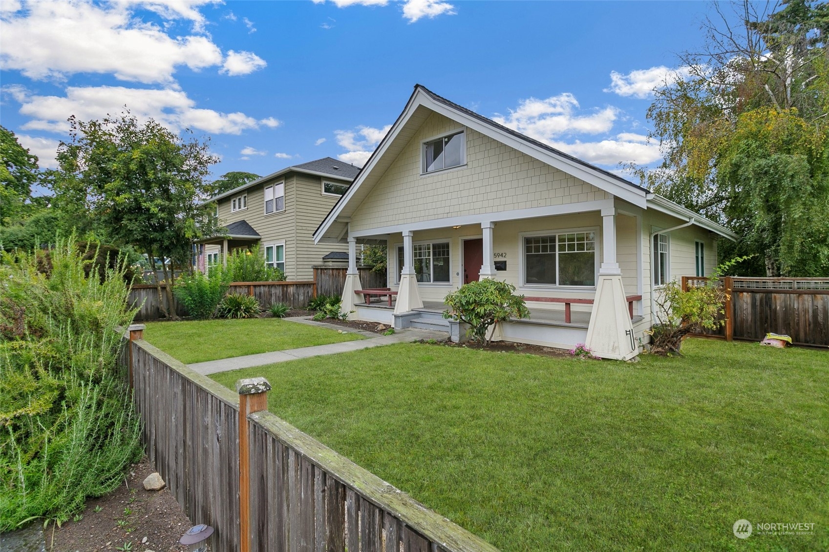 5942 41st Avenue Southwest Seattle, WA 98136 - Photo 39 of 40 a front view of house with yard and green space