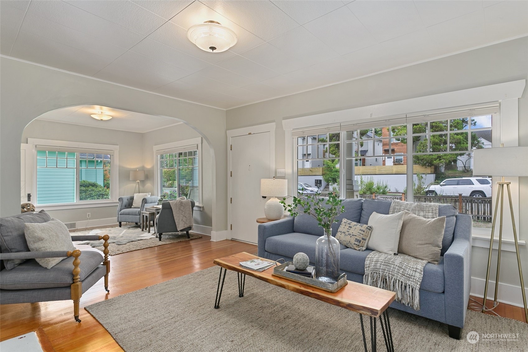 5942 41st Avenue Southwest Seattle, WA 98136 - Photo 4 of 40 a living room with furniture and a large window