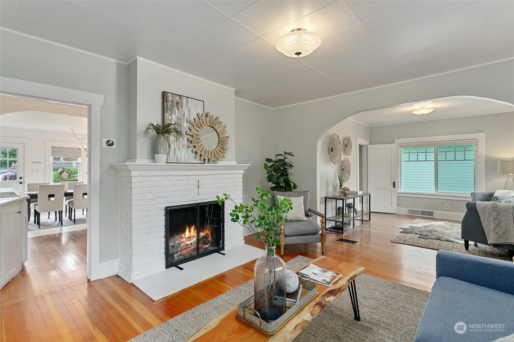 5942 41st Avenue Southwest Seattle, WA 98136 - Photo 5 of 40 a living room with furniture and a fireplace