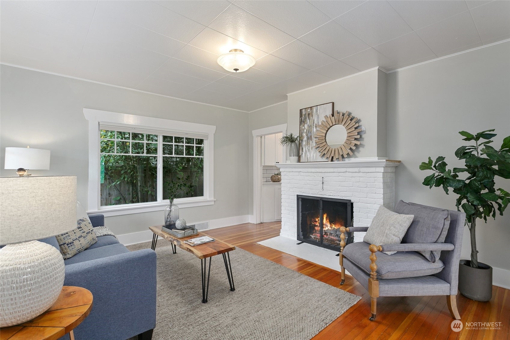 5942 41st Avenue Southwest Seattle, WA 98136 - Photo 6 of 40 a living room with furniture and a fireplace