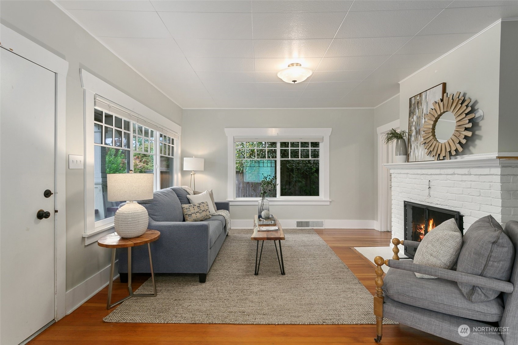 5942 41st Avenue Southwest Seattle, WA 98136 - Photo 7 of 40 a living room with furniture and a fireplace