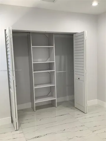 a view of an empty walk in closet