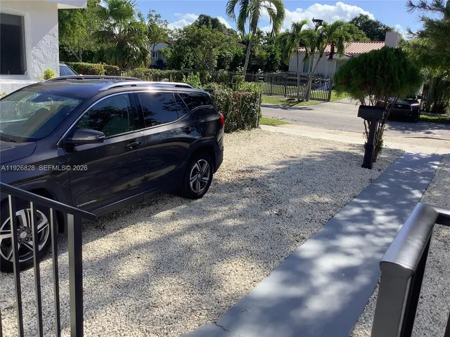 a view of a yard with patio and fire pit