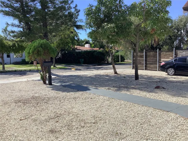 a building with trees in front of it