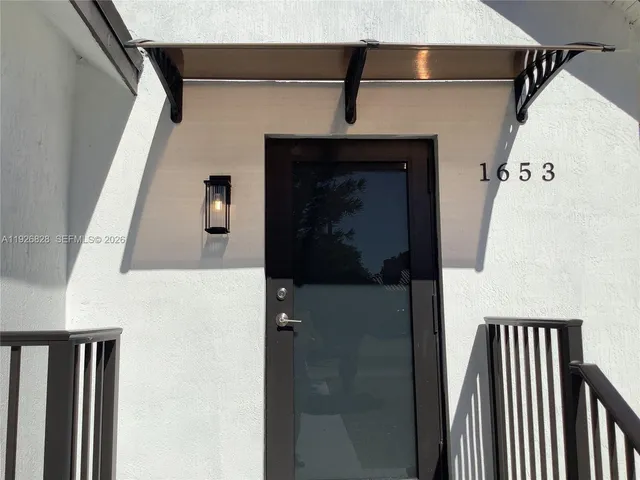 a view of a backyard with potted plants