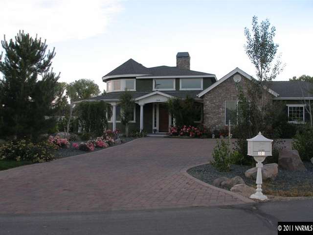 300 Vera Drive Reno, NV 89511 - Photo 2 of 13 a front view of house with yard and trees around
