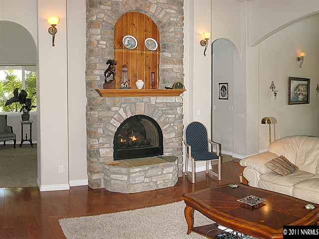 300 Vera Drive Reno, NV 89511 - Photo 3 of 13 a living room with furniture and a fireplace