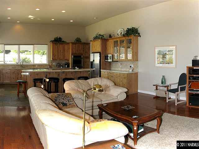 300 Vera Drive Reno, NV 89511 - Photo 4 of 13 a living room with furniture a rug and kitchen view