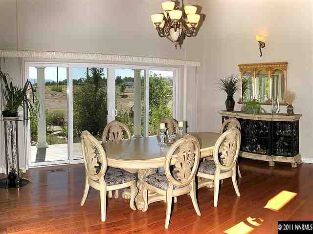 300 Vera Drive Reno, NV 89511 - Photo 5 of 13 a view of a dining room with furniture wooden floor and chandelier