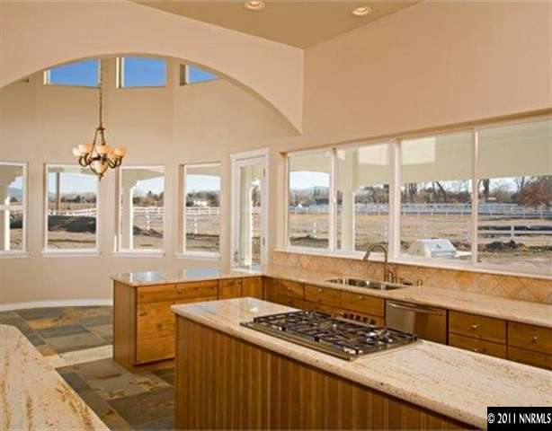 300 Vera Drive Reno, NV 89511 - Photo 6 of 13 a kitchen with a stove a sink and cabinets