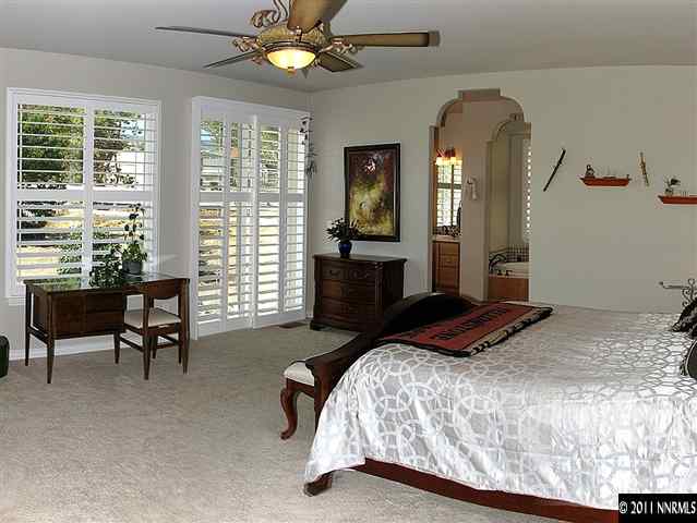 300 Vera Drive Reno, NV 89511 - Photo 8 of 13 a bedroom with a bed and a couch