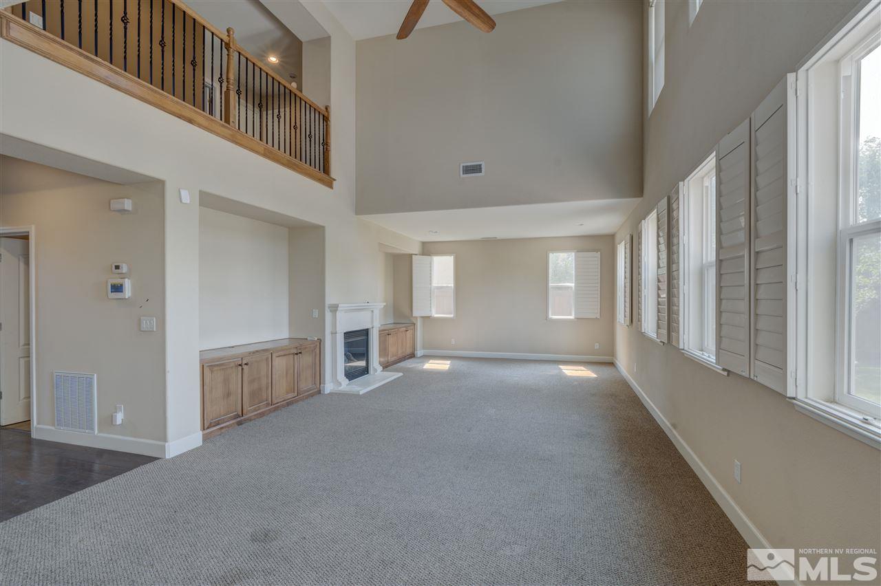 11105 Parma Way Reno, NV 89521 - Photo 4 of 32 a view of a big room with chandelier and windows