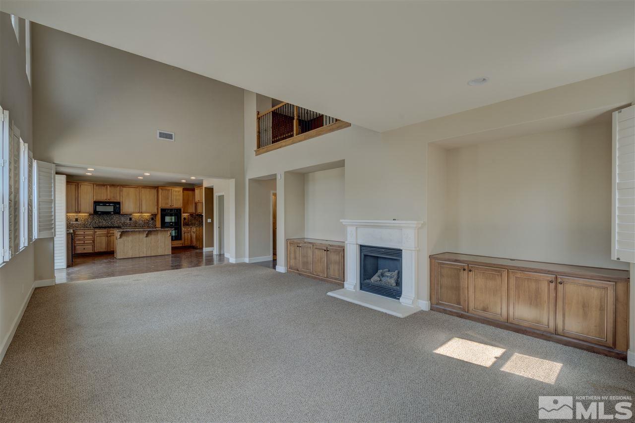 11105 Parma Way Reno, NV 89521 - Photo 5 of 32 a view of a livingroom with furniture and a fireplace