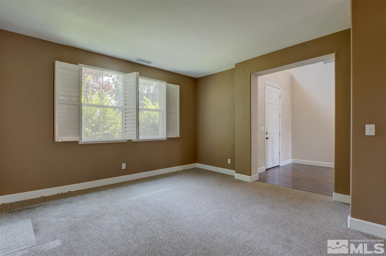 11105 Parma Way Reno, NV 89521 - Photo 8 of 32 an empty room with a window