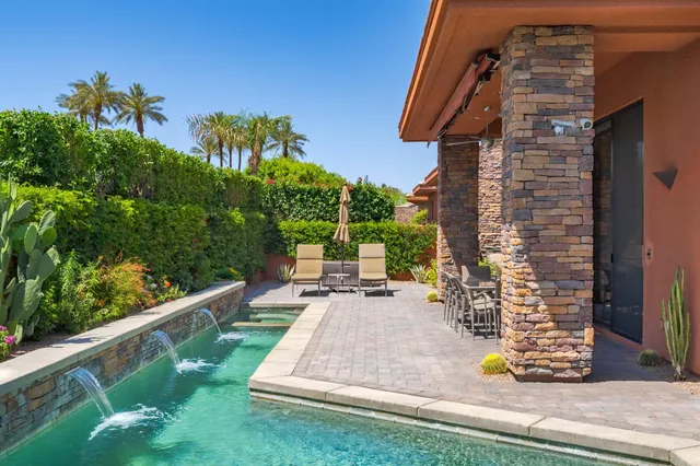 a view of a building with a yard