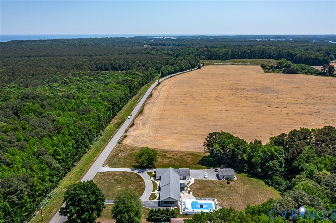 4400 Hacks Neck Road Heathsville, VA 22473 - Photo 4 of 78 an aerial view of a house with a garden and lake view