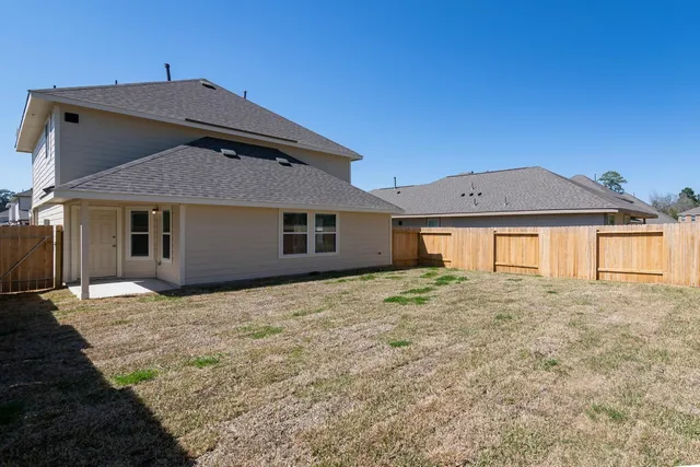 a front view of a house with yard