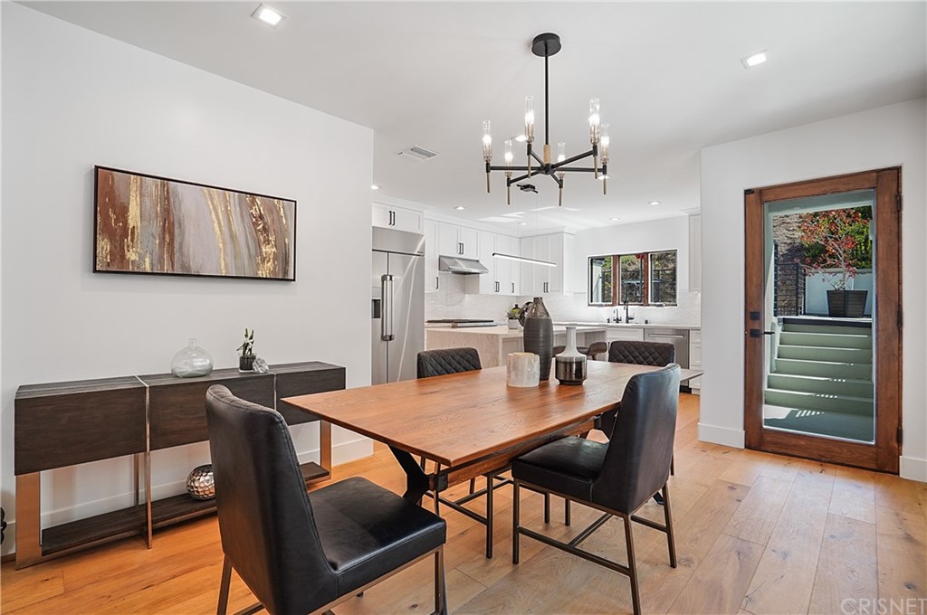 431 Nesmuth Road Glendale, CA 91202 - Photo 14 of 68 a view of a dining room with furniture wooden floor and chandelier