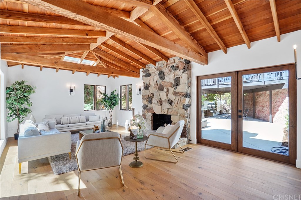 431 Nesmuth Road Glendale, CA 91202 - Photo 29 of 68 a view of a dining room with furniture wooden floor and a potted plant