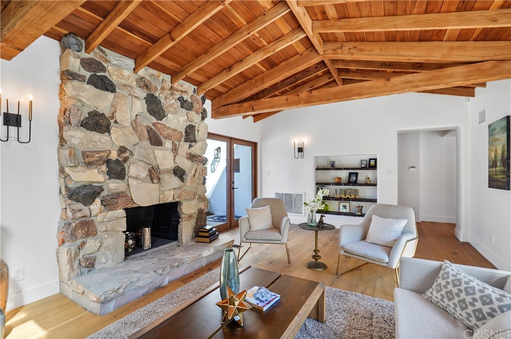 431 Nesmuth Road Glendale, CA 91202 - Photo 32 of 68 a living room with furniture and a fireplace